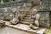 Candi Cetho - Guardians standing on the ninth terrace at the base of the staircase leading to the tenth terrace. 